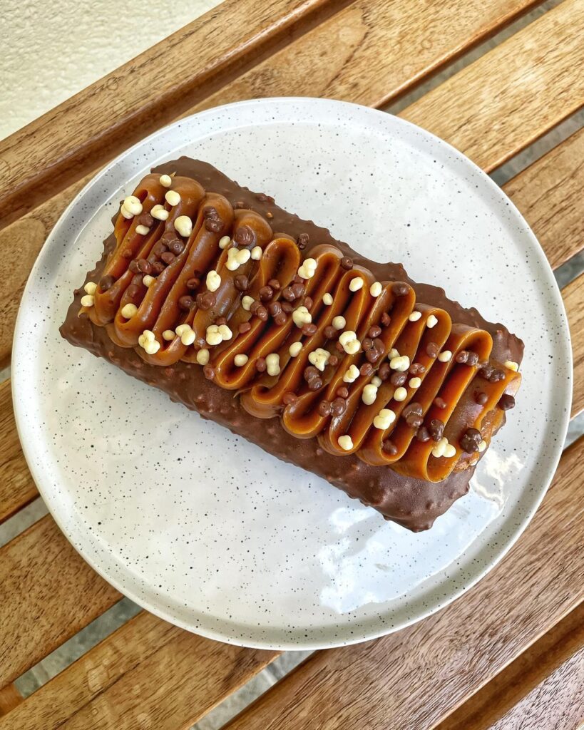 Gourmet Marbled Cake with Praline Crunch, Rocher Glaze, and Smooth Caramel