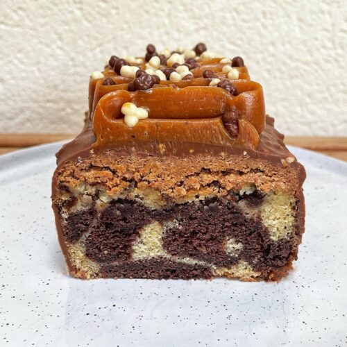 Gourmet Marbled Cake with Praline Crunch, Rocher Glaze, and Smooth Caramel