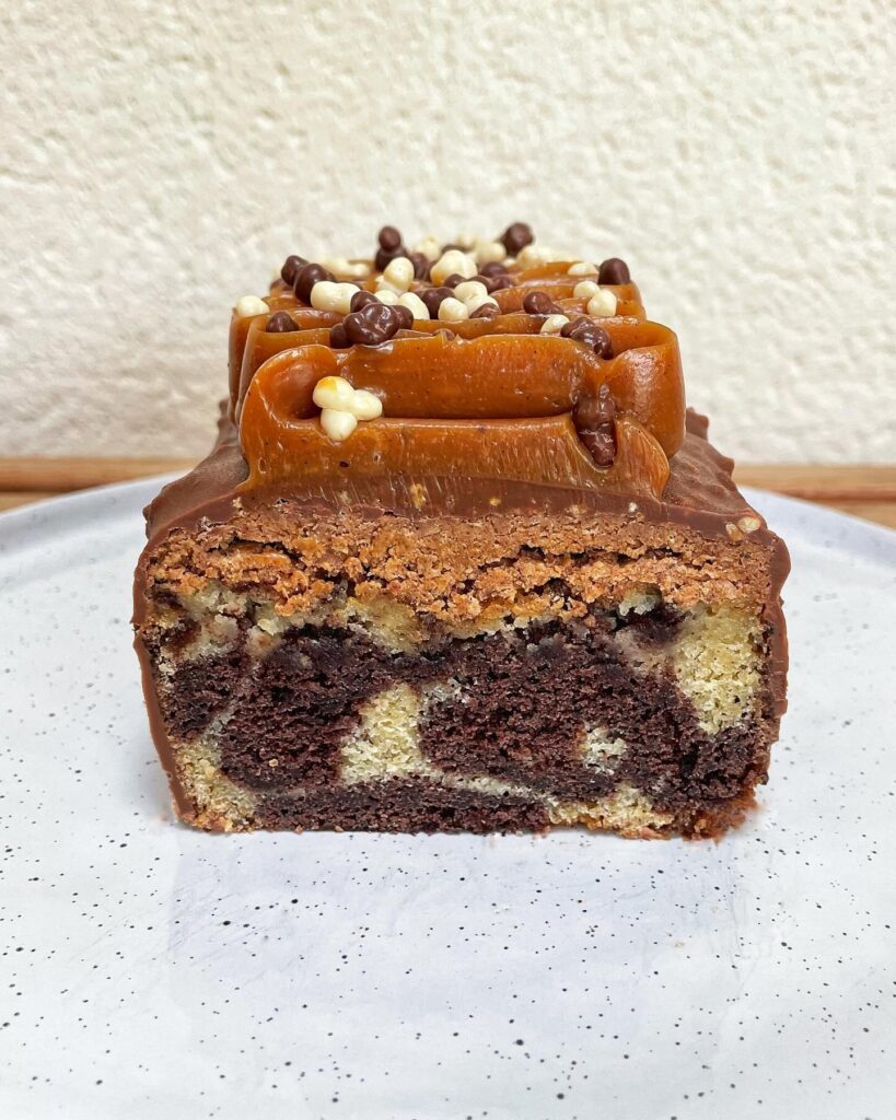 Gourmet Marbled Cake with Praline Crunch, Rocher Glaze, and Smooth Caramel