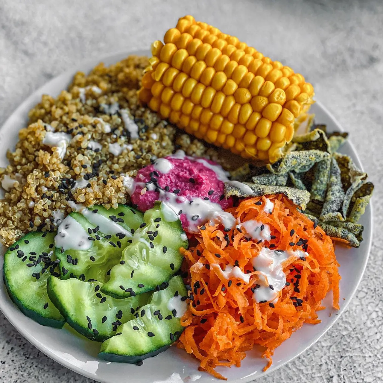 Vibrant Vegan Quinoa Buddha Bowl with Beetroot Hummus and Seaweed Crunch